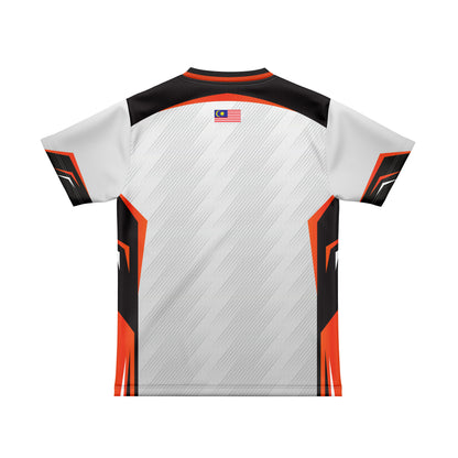 A short-sleeve athletic jersey shown from the back, featuring a white base with diagonal gray stripe texture, black shoulder panels, and bright orange geometric side accents. A small Malaysian flag patch is printed near the upper center back.